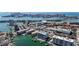 An aerial view of the waterfront condo community and surrounding neighborhood at 125 Island Way # 404, Clearwater Beach, FL 33767