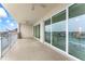 Balcony with sliding glass doors features a white railing with views of the city and river at 125 Island Way # 404, Clearwater Beach, FL 33767