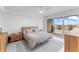 Bright bedroom featuring a modern platform bed and a sliding glass door to a private balcony at 125 Island Way # 404, Clearwater Beach, FL 33767