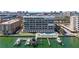 Condo building with boat slips, pool, and beautiful architecture at 125 Island Way # 404, Clearwater Beach, FL 33767