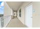 Exterior hallway with unit number and view of the landscape from the corridor at 125 Island Way # 404, Clearwater Beach, FL 33767