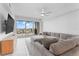 Bright living room featuring comfortable seating, tile floors, and a ceiling fan at 125 Island Way # 404, Clearwater Beach, FL 33767
