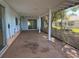 Spacious outdoor patio area, screened in with a concrete floor and a view of the backyard at 12607 Blackberry Row, Hudson, FL 34667