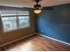 Bedroom with a ceiling fan, natural light, and views of the backyard at 12607 Blackberry Row, Hudson, FL 34667