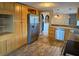 Spacious kitchen with granite countertops, stainless steel refrigerator and tile flooring at 12607 Blackberry Row, Hudson, FL 34667