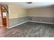 Open concept living area with laminate flooring and two-tone walls at 12607 Blackberry Row, Hudson, FL 34667