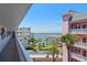 Balcony view overlooking the grounds, pool, and Sarasota Bay at 131 Bluff View Dr # 409, Belleair Bluffs, FL 33770