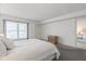 Bright bedroom with neutral carpet and a bed with pillows at 131 Bluff View Dr # 409, Belleair Bluffs, FL 33770