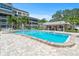 Community pool area features lounge chairs and a covered seating area at 131 Bluff View Dr # 409, Belleair Bluffs, FL 33770