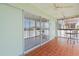 Screened sunroom features tile flooring and sliding glass door at 131 Bluff View Dr # 409, Belleair Bluffs, FL 33770