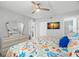 Bedroom featuring light walls, hard flooring, and a nautical themed comforter and pillows at 14900 Gulf Blvd # 304, Madeira Beach, FL 33708