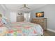 Bright bedroom featuring light walls, hard flooring, and a nautical themed comforter at 14900 Gulf Blvd # 304, Madeira Beach, FL 33708