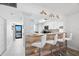 Stylish kitchen bar with seating, wood accents, and views of the water at 14900 Gulf Blvd # 304, Madeira Beach, FL 33708