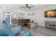 Bright living room featuring modern flooring, comfortable seating, and stylish coastal decorations at 14900 Gulf Blvd # 304, Madeira Beach, FL 33708