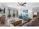 Cozy living room with sliding glass doors to the balcony and comfortable seating at 14900 Gulf Blvd # 304, Madeira Beach, FL 33708