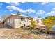 The backyard features a wood deck surrounded by tropical plants at 1510 Lakeside Dr, Dunedin, FL 34698