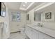 Bright bathroom with a marble vanity, plenty of natural light, and a sleek design at 1510 Lakeside Dr, Dunedin, FL 34698