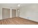 Bedroom features wood floor and large closets at 1510 Lakeside Dr, Dunedin, FL 34698