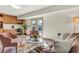 The living room features a wet bar with a view of the outdoor pool at 1510 Lakeside Dr, Dunedin, FL 34698