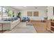 Cozy living area with a large window, hardwood floors, and neutral decor at 1510 Lakeside Dr, Dunedin, FL 34698