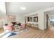 An airy living room seamlessly connects to the bar and open layout of the kitchen at 1510 Lakeside Dr, Dunedin, FL 34698