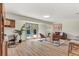 A cozy living room with outdoor access and a dedicated workstation at 1510 Lakeside Dr, Dunedin, FL 34698