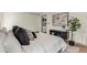 Bed with a neutral color scheme, dark furniture, and seamlessly flows into other spaces at 1510 Lakeside Dr, Dunedin, FL 34698