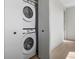 Convenient in-unit laundry featuring a stacked washer and dryer at 1515 Greenwood N Ave, St Petersburg, FL 33704