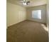 Bedroom with carpeted floor, a window for natural light, and a large closet at 16415 Enclave Village Drive # 108, Tampa, FL 33647