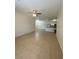 Open concept living room flowing to kitchen at 16415 Enclave Village Drive # 108, Tampa, FL 33647