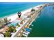 Breathtaking aerial view showcasing the home's prime beachfront location at 20256 Gulf Blvd, Indian Shores, FL 33785