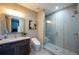 Modern bathroom featuring a glass-enclosed shower, contemporary fixtures, and neutral tones at 20256 Gulf Blvd, Indian Shores, FL 33785
