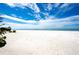 Expansive view of a pristine white sand beach and turquoise water at 20256 Gulf Blvd, Indian Shores, FL 33785