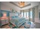Cozy bedroom featuring ocean view, coastal decor, with a white dresser, and a tropical-themed bed at 20256 Gulf Blvd, Indian Shores, FL 33785