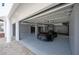 Spacious garage with epoxy floor and storage cabinets, showcasing a sleek black sports car at 20256 Gulf Blvd, Indian Shores, FL 33785