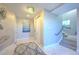 Inviting hallway with neutral tones, elegant lighting, and a staircase at 20256 Gulf Blvd, Indian Shores, FL 33785