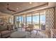 Living room featuring stylish furnishings, bright natural light, and stunning ocean views at 20256 Gulf Blvd, Indian Shores, FL 33785