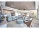 Spacious living room with large sectional sofa and elegant decor with open floor plan to kitchen and dining area at 20256 Gulf Blvd, Indian Shores, FL 33785