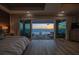 Beautiful main bedroom showcasing water views, balcony access, stylish decor, and luxurious comfort at 20256 Gulf Blvd, Indian Shores, FL 33785