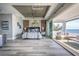 A bright main bedroom boasts wood accents, recessed lighting, and a sliding glass door to an ocean-view balcony at 20256 Gulf Blvd, Indian Shores, FL 33785