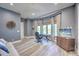 Home office with natural light, a desk, an office chair, a sofa and a TV with views of the outside at 20256 Gulf Blvd, Indian Shores, FL 33785