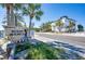 Indian Shores property with palm trees, welcome sign, and well-maintained landscape at 20256 Gulf Blvd, Indian Shores, FL 33785