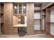 Custom walk-in closet with built-in shelving, drawers, vanity, and mirrored walls maximizes storage space and organization at 20256 Gulf Blvd, Indian Shores, FL 33785