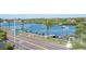 Scenic waterfront view with boat docks, lush greenery, and a glimpse of coastal living at 20256 Gulf Blvd, Indian Shores, FL 33785