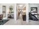 Bright hallway with wood floors and decorative furnishings leading to the living areas at 2301 S Church Ave, Tampa, FL 33629