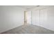 Bedroom featuring neutral carpet, a closet, and a white door at 23343 Van Buren Ave, Port Charlotte, FL 33981