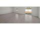 Open living room with sliding glass doors and bright natural light at 23343 Van Buren Ave, Port Charlotte, FL 33981