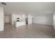 Open concept living room with tile flooring, recessed lighting, and bright natural light at 23343 Van Buren Ave, Port Charlotte, FL 33981