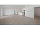 Open-concept living room and kitchen with tile floors, recessed lighting, and lots of natural light at 23343 Van Buren Ave, Port Charlotte, FL 33981