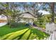 Quaint home featuring manicured front lawn, walkway, mature trees, and a picket fence at 2608 2Nd N Ave, St Petersburg, FL 33713